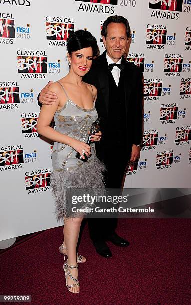 Angela Gheorghiu poses with the Female Artist of the Year Award and Richard E Grant during the Classical BRIT Awards at Royal Albert Hall on May 13,...