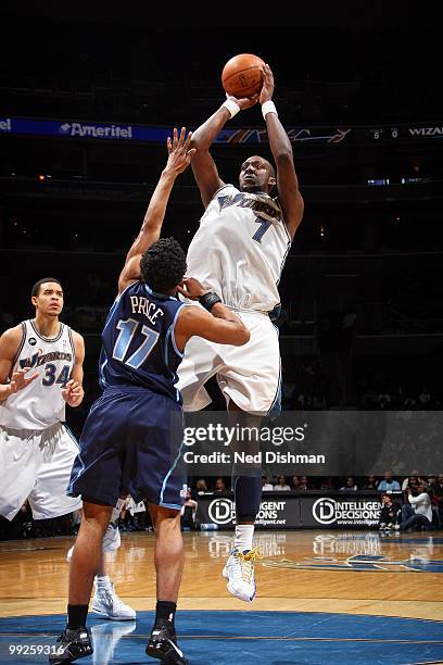 Andray Blatche of the Washington Wizards shoots against Ronnie Price of the Utah Jazz during the game at the Verizon Center on March 27, 2010 in...