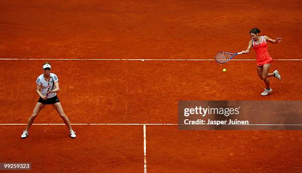 Virginia Ruano Pascual of Spain plays a forehand with her doubles partner Meghann Shaughnessy of the USA in their quarter final doubles match against...