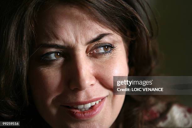 Italian director Sabina Guzzanti poses as she presents her film "Draquila - L'Italia Che Trema" as part of a special screening at the 63rd Cannes...