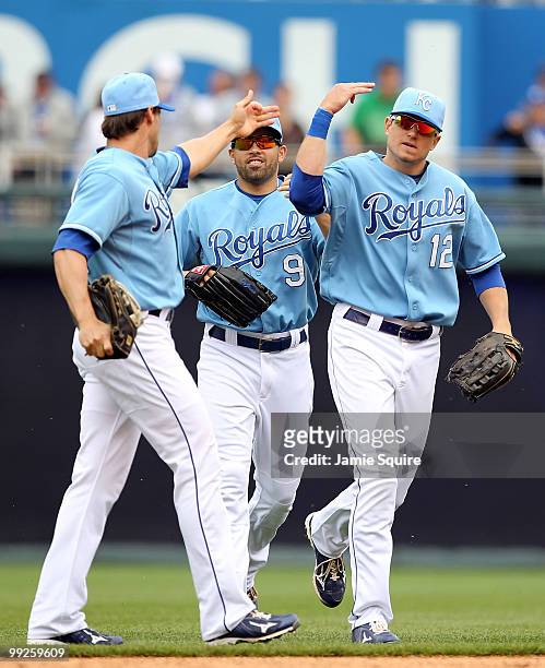 Outfielders Scott Podsednik, David DeJesus, and Mitch Maier of the Kansas City Royals celebrate after the Royals defeated the Cleveland Indians 6-4...
