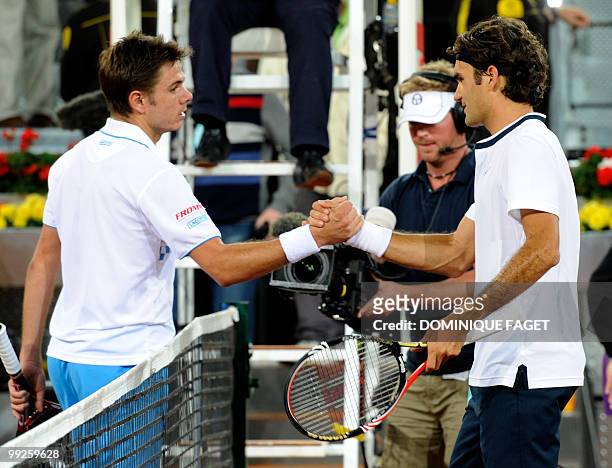 Swiss Stanislas Wawrinka congratulates his compatriot Roger federer at the end of their match of the Madrid Masters on May 13, 2010 at the Caja Magic...