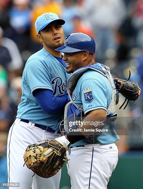 Pitcher Joakim Soria of the Kansas City Royals is congratulated by catcher Brayan Pena after the Royals defeated the Cleveland Indians 6-4 to win the...