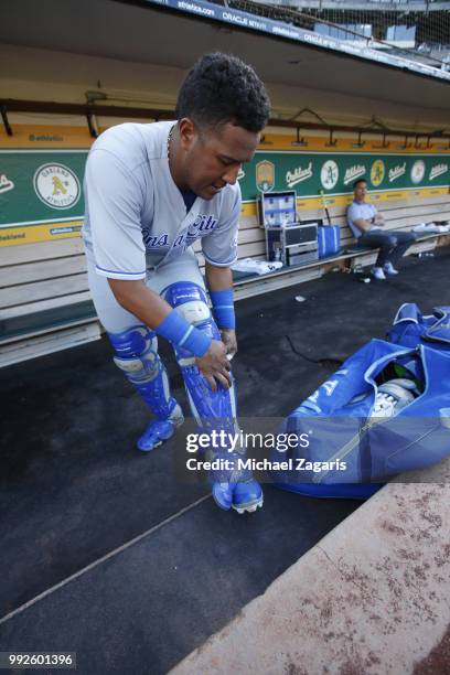 Salvador Perez of the Kansas City Royals puts his catchers gear on in the dugout prior to the game against the Oakland Athletics at the Oakland...