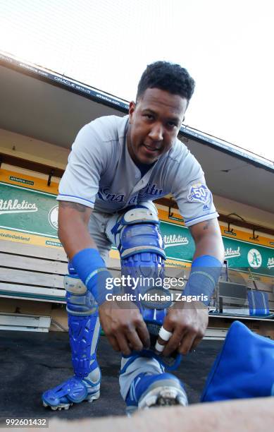 Salvador Perez of the Kansas City Royals puts his catchers gear on in the dugout prior to the game against the Oakland Athletics at the Oakland...