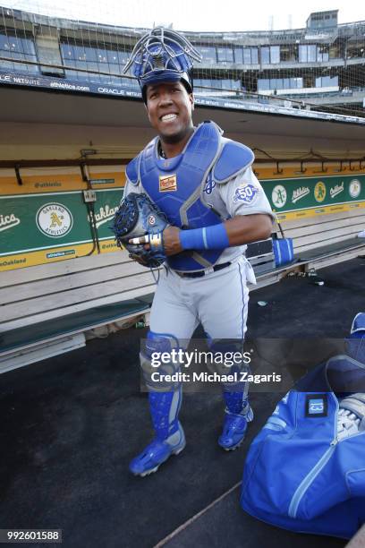 Salvador Perez of the Kansas City Royals puts his catchers gear on in the dugout prior to the game against the Oakland Athletics at the Oakland...