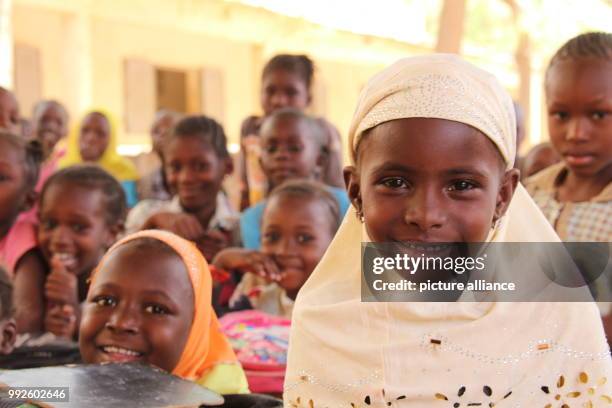 March 2018, Mali, Mopti: Seven year old Adiata Zongo and her fellow classmates sit inside a class room of the Moulaye Dembele School built by UNICEF....