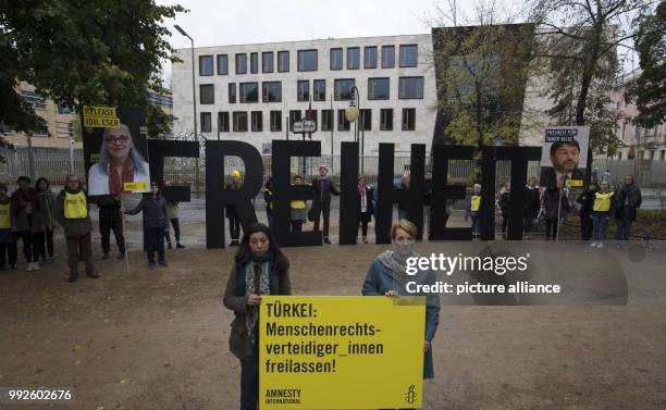 Activits of Amnesty International hold up large letters spelling "FREIHEIT" in front of the Turkish embassy in Berlin, Germany, 25 October 2017....