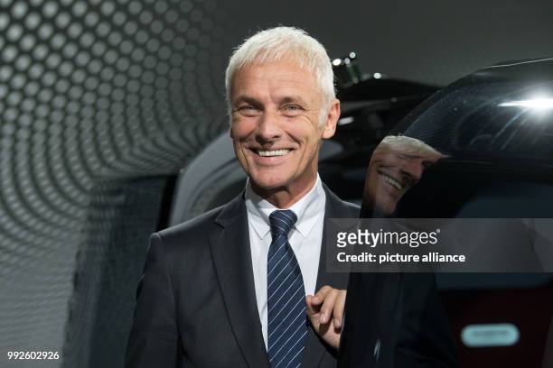 The chairman of the VW AG, Matthias Mueller, can be seen standing next to the Volskwagen concept vehicle "Sedric" after his preformance at the...