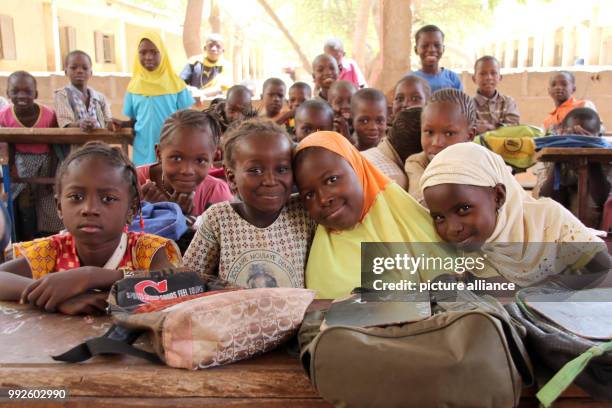 March 2018, Mali, Mopti: Seven year old Adiata Zongo and her fellow classmates sit inside a class room of the Moulaye Dembele School built by UNICEF....