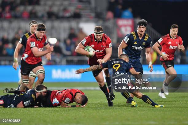 Wyatt Crockett of the Crusaders charges forward during the round 18 Super Rugby match between the Crusaders and the Highlanders at AMI Stadium on...