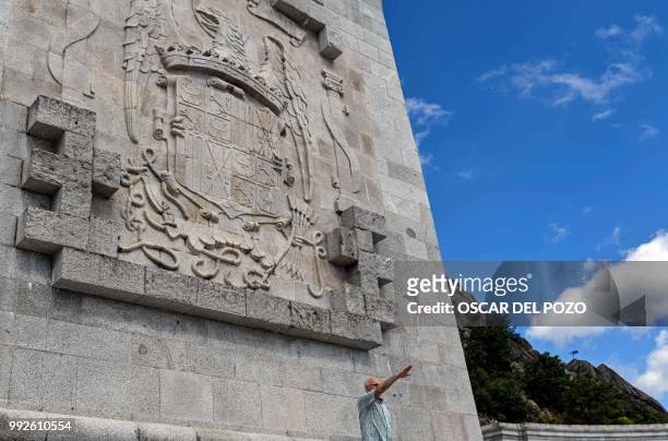 Man makes the fascist salute at Valle de los Caidos , a monument to the Francoist combatants who died during the Spanish civil war and Spain's...