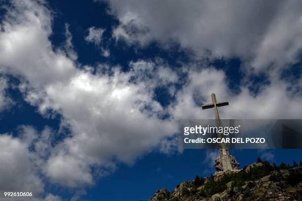 Picture taken on July 03, 2018 in San Lorenzo del Escorial, near Madrid of the Valle de los Caidos , a monument to the Francoist combatants who died...