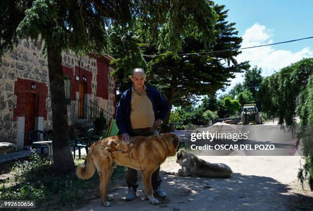 Nicolas Sanchez-Albornoz, ex-Franco prisoner, poses in front of his house in Avila, near Madrid, on July 03, 2018. OSCAR DEL POZO / AFP - Seventy...