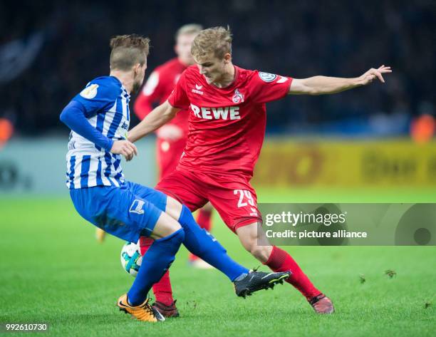 Berlin's Peter Pekarik and Cologne's Tim Handwerker vying for the ball during the DFB Cup soccer match between Hertha BSC vs 1. FC Cologne in Berlin,...