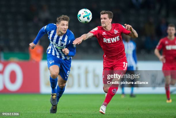 Hertha's Niklas Stark vies for the ball with Cologne's Simon Zoller during the German DFB Pokal football match between Hertha BSC and 1. FC Cologne...