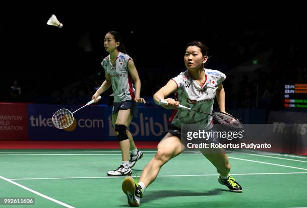 Misaki Matsutomo and Ayaka Takahashi of Japan compete against Huang Dongping and Li Wenmei of China during the Women's Doubles Quarter-final match on...