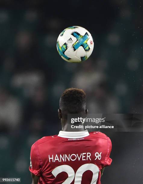 Hannover's Salif Sane heading the ball during the DFB Cup soccer match between VfL Wolfsburg and Hannover 96 in the Volkswagen Arena in Wolfsburg,...