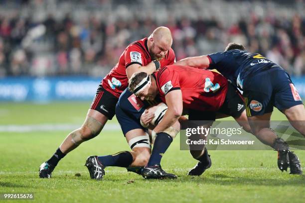 Owen Franks and Wyatt Crockett of the Crusaders maker a tackle during the round 18 Super Rugby match between the Crusaders and the Highlanders at AMI...