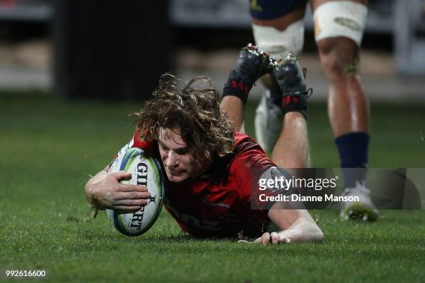 George Bridge of the Crusaders dives over to score a try during the round 18 Super Rugby match between the Crusaders and the Highlanders at AMI...