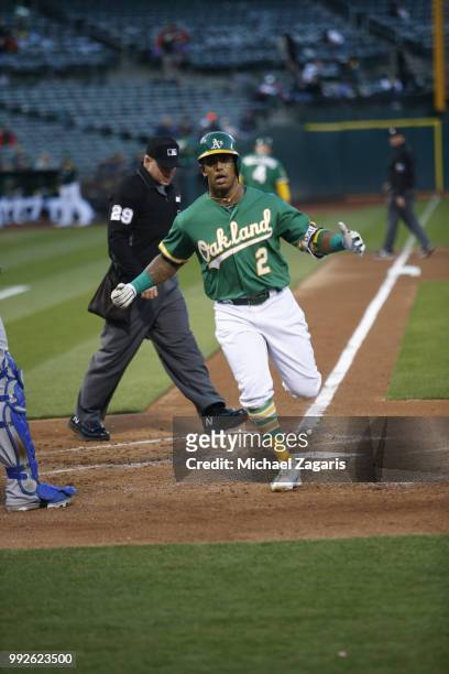 Khris Davis of the Oakland Athletics celebrates after hitting his second home run of the night during the game against the Kansas City Royals at the...