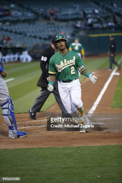 Khris Davis of the Oakland Athletics celebrates after hitting his second home run of the night during the game against the Kansas City Royals at the...