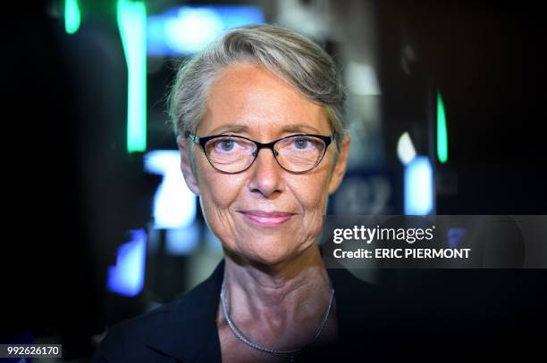 French Transport Minister Elisabeth Borne poses for a picture as she answers questions in front of "Parafe", an automated border passport control,...