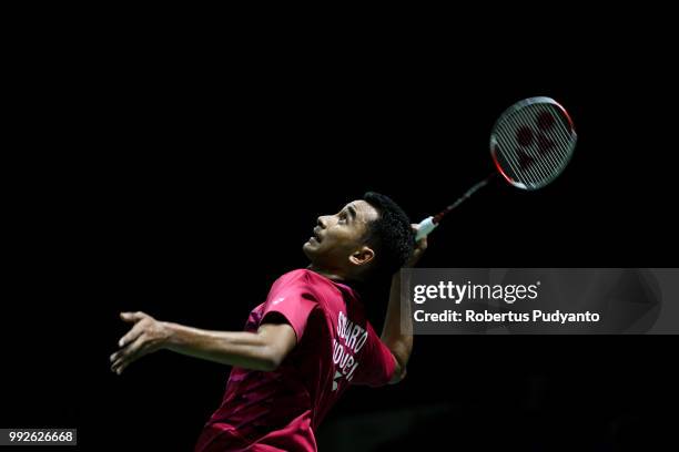 Tommy Sugiarto of Indonesia competes against Kento Momota of Japan during the Men's Singles Quarter-final match on day four of the Blibli Indonesia...
