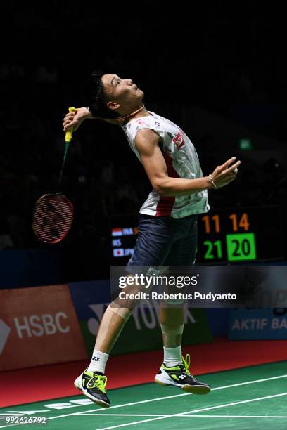 Kento Momota of Japan competes against Tommy Sugiarto of Indonesia during the Men's Singles Quarter-final match on day four of the Blibli Indonesia...