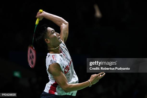 Kento Momota of Japan competes against Tommy Sugiarto of Indonesia during the Men's Singles Quarter-final match on day four of the Blibli Indonesia...