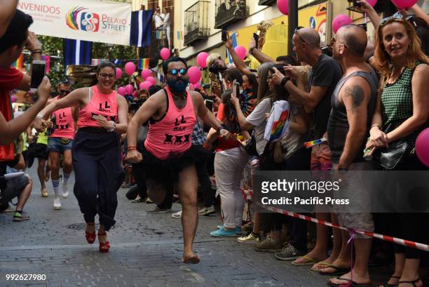 Competitors run during the Gay Pride High Heels race in Madrid.