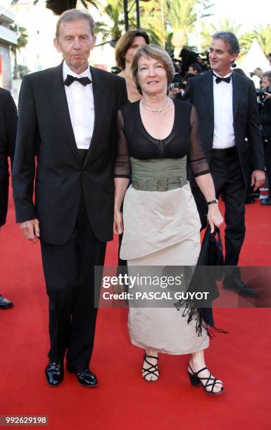 French tv TF1 vice-chairman Etienne Mougeotte and his wife arrive at the Festival Palace to attend the premiere of French director Xavier Giannoli's...