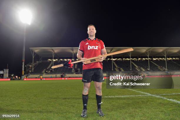 Wyatt Crockett of the Crusaders poses with a taiaha, a traditional Maori weapon, after his 200th Super Rugby match during the round 18 Super Rugby...