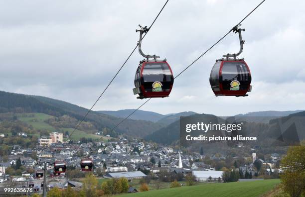 Two cabins of the Ettelsberg cableway passing by each other in Willingen, Germany, 26 October 2017. A new chairlift is being built in the winter...