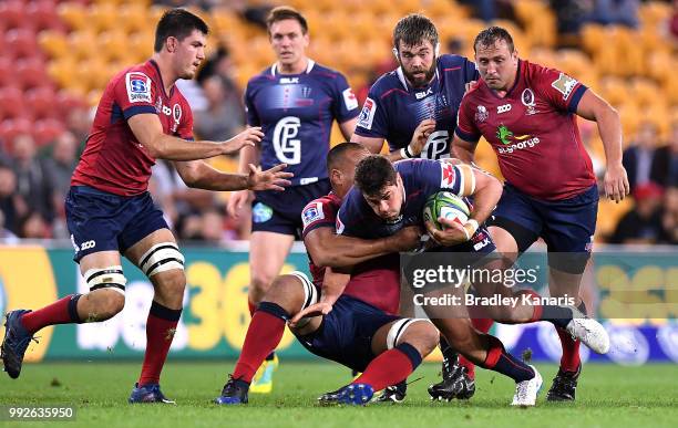 Tom English of the Rebels takes on the defence during the round 18 Super Rugby match between the Reds and the Rebels at Suncorp Stadium on July 6,...