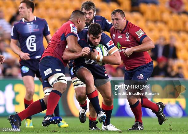 Tom English of the Rebels takes on the defence during the round 18 Super Rugby match between the Reds and the Rebels at Suncorp Stadium on July 6,...