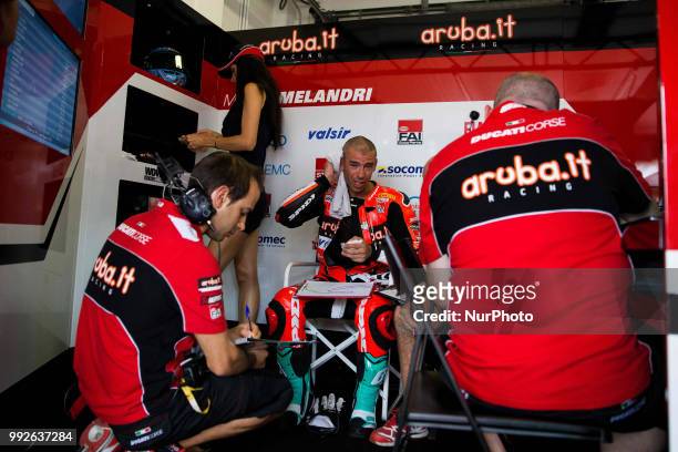 Marco Melandri of Aruba.it Racing - Ducati speaks in box with mechanics during the free practice of the Motul FIM Superbike Championship, Riviera di...