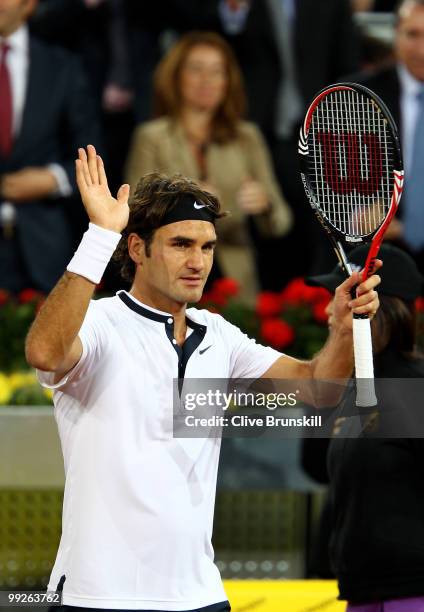 Roger Federer of Switzerland celebrates after his straight sets victory against Stanislas Wawrinka of Switzerland in their third round match during...