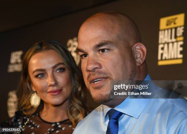 Model Amber Nichole Miller looks on as mixed martial artist Tito Ortiz is interviewed at the UFC Hall of Fame's class of 2018 induction ceremony at...