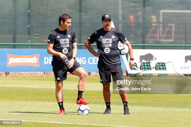 David Wagner the manager of Huddersfield Town and Dean Whitehead coach of Huddersfield Town watch pre season training on July 5, 2018 in...