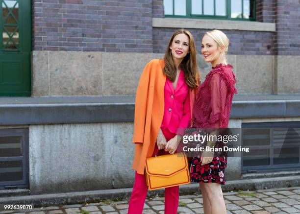 Kathrin Gelinsky and Alexandra Lapp poses during the Marc Cain Street Style shooting at WECC on July 3, 2018 in Berlin, Germany.