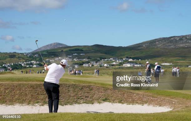 Shane Lowry of Ireland plays his second shot on the par four 16th hole during the second round of the Dubai Duty Free Irish Open at Ballyliffin Golf...
