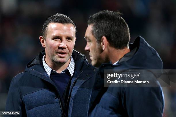 Aaron Mauger, head coach of the Highlanders, and Mark Hammett, assistant coach of the Highlanders, look on ahead of the round 18 Super Rugby match...