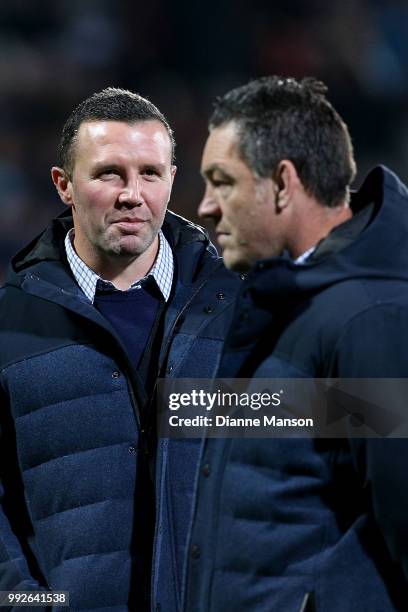 Aaron Mauger, head coach of the Highlanders, and Mark Hammett, assistant coach of the Highlanders, look on ahead of the round 18 Super Rugby match...