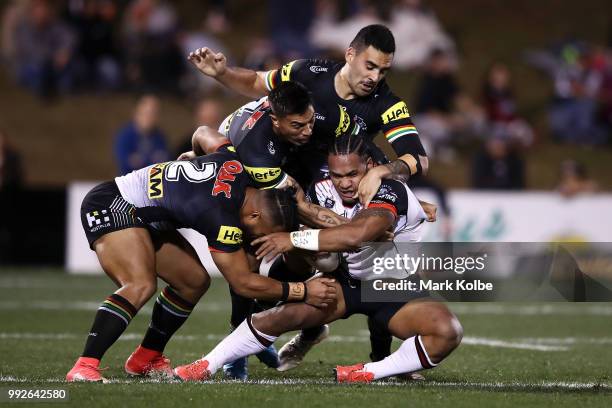 Solomone Kata of Warriors is tackled during the round 17 NRL match between the Penrith Panthers and the New Zealand Warriors at Panthers Stadium on...