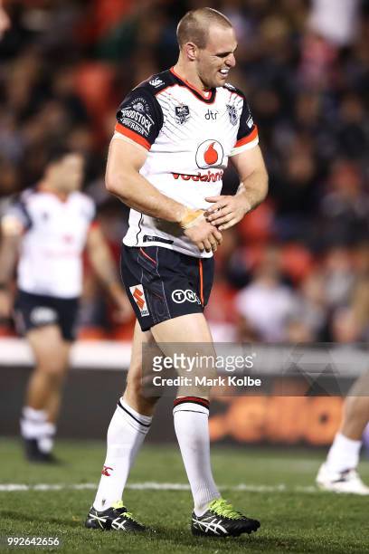 Simon Mannering of the Warriors grimaces after a tackle during the round 17 NRL match between the Penrith Panthers and the New Zealand Warriors at...
