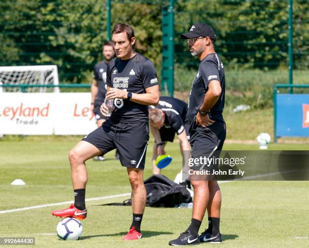 David Wagner the manager of Huddersfield Town and Dean Whitehead coach of Huddersfield Town watch pre season training on July 5, 2018 in...