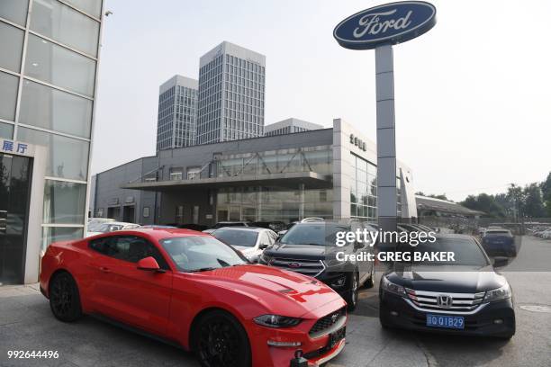 Ford Mustang is seen at a dealership in Beijing on July 6, 2018. - China said on July 6 it was "forced to take necessary countermeasures," after...