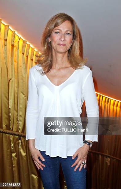 At the opening of the ephemeral restaurant Le Jardin de Joy in the Hotel Barriere Le Fouquet's, Anne Gravoin is photographed for Paris Match on june...