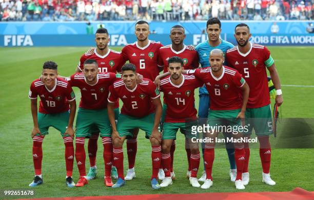 Morocco team pose for a team photograph with one player missing during the 2018 FIFA World Cup Russia group B match between Morocco and Iran at Saint...